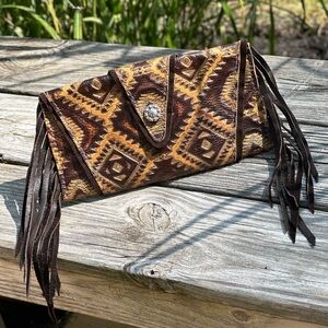 Aztec leather wrap clutch with fringe